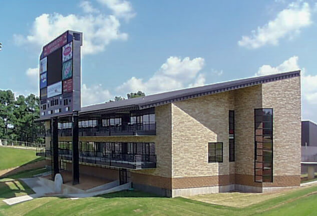 Fieldhouse and scoreboard with terrace and ramp