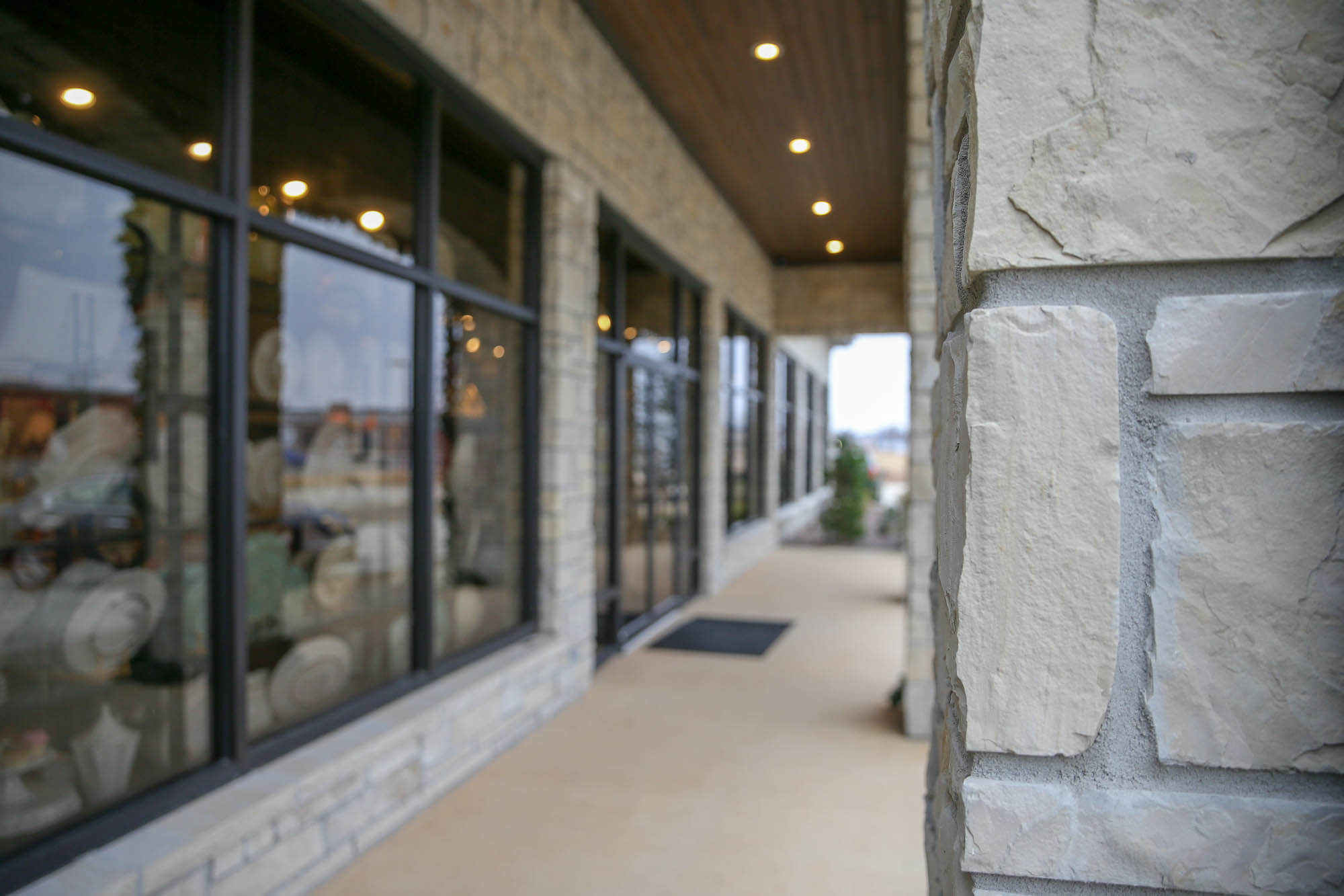 Close-up shot of the stone column at the entrance of 'The Everyday Chef' storefront