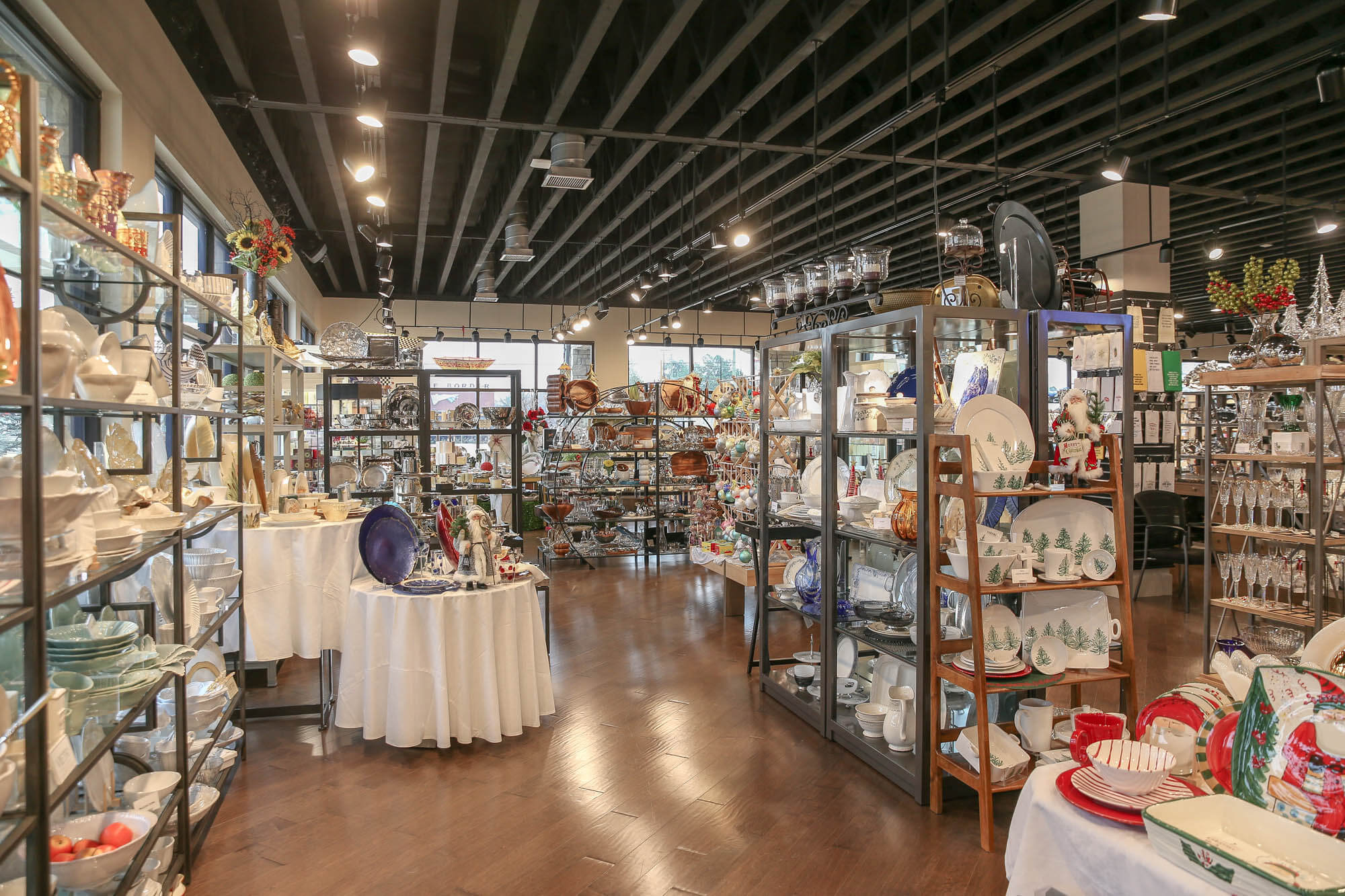 Interior shot - the space has a festive holiday theme with Christmas decorations, red and white dishware, and seasonal items
