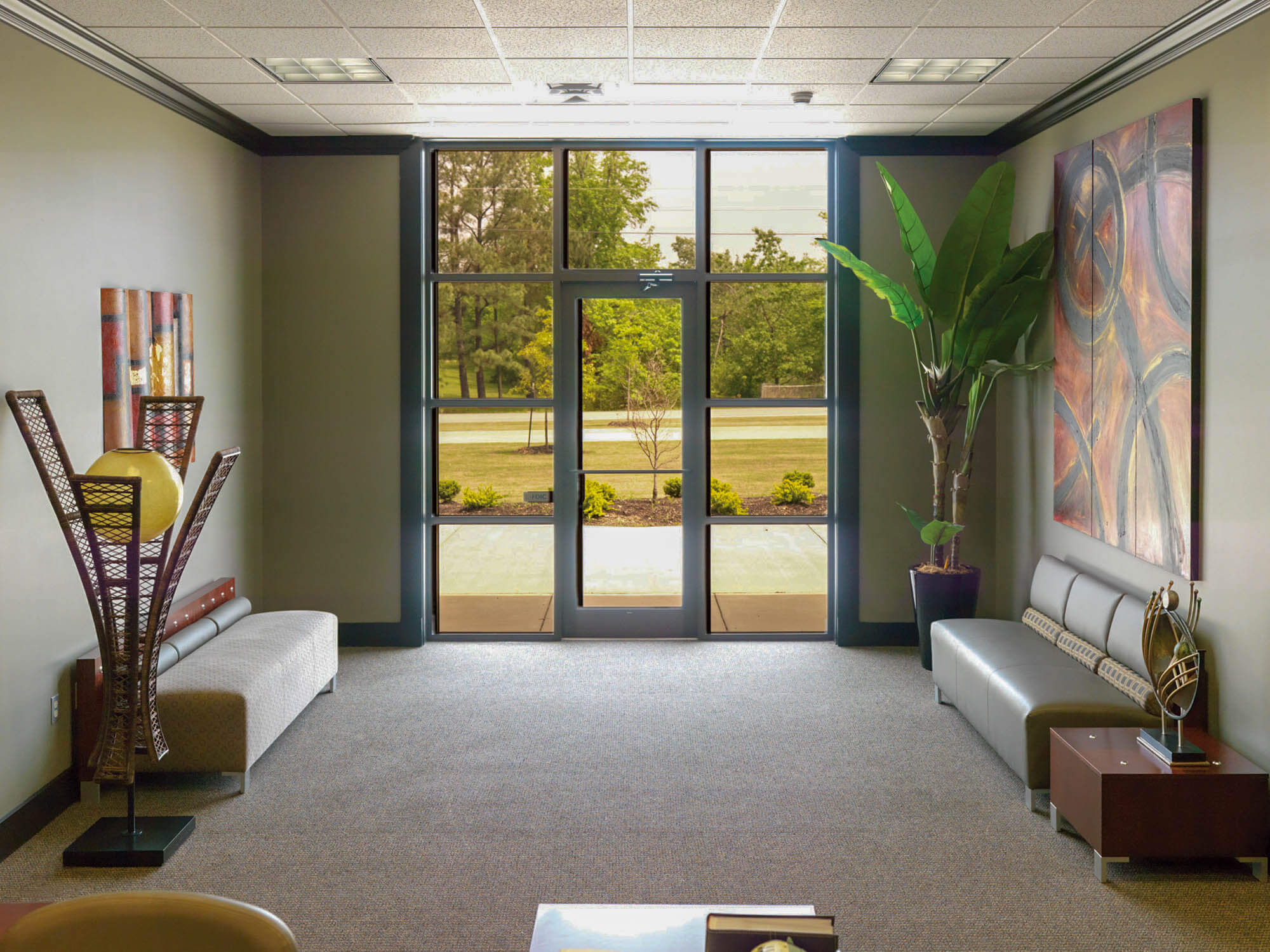Interior shot of the foyer at Focus Bank, designed with a contemporary neutral color palette