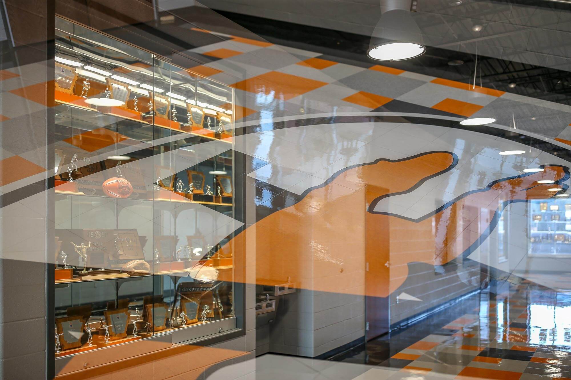 Multiple exposure of greyhound logo and trophy case
