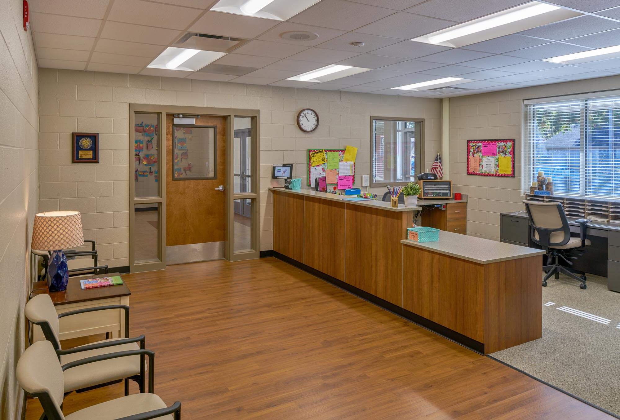 Interior of Richland Elementary office with reception desk, seating area, and bulletin boards
