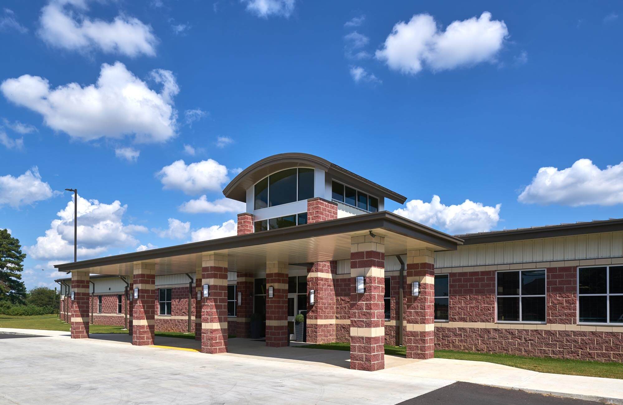 Trumann Elementary School entrance with covered walkway and tall glass tower